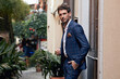 © kiuikson - Young handsome man in classik checked suit standing on the street