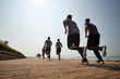 © imtmphoto - group of young asian adults running outdoors