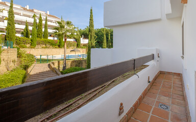 empty wooden table and chairs on the terrace in summer