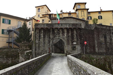 Wall Mural - The Porta Miccia or Porta di Castruccio seen from the Ponte Santa Lucia by Castruccio Castracani in the old town of Castelnuovo di Garfagnana