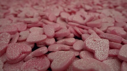 Wall Mural - pink macro confectionery sprinkling heart-shaped background. food decoration for valentines day or 1