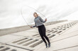 © splitov27 - Sport fit woman jumping rope outdoors. Healthy lifestyle