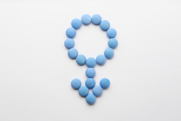 Wall Mural - Male symbol made with pills on white background, flat lay. Potency problems