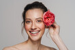 © Drobot Dean - Smiling half-naked woman posing with flower on camera