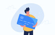 Happy smiling man hugging big credit card. Flat modern concept vector illustration of people who use credit and debit bank card for payment and banking. Casual consumer with card on white background