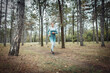 © splitov27 - Woman runner with perfect body is practicing jogging in the forest