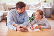 © Monkey Business - Father Helping Daughter Sitting At Table With Digital Tablet Home Schooling During Health Pandemic
