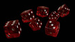 falling red dice on black isolated
