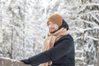 © Julija - Attractive happy bearded man standing outdoors in mountain winter forest.