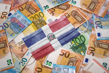 medical mask with the flag of dominican republic on a variety of european banknotes.(series)