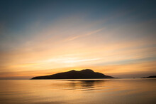 Sunrise Over Holy Island From Lamlash Beach On The Isle Of Arran