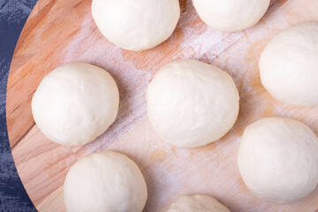 Wall Mural - Yeast dough balls on the wooden board