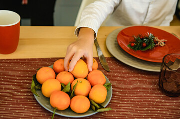 person and orange