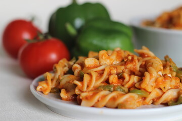 Wall Mural - Red sauce pasta with bell peppers. Homemade Fusilli Pasta with Arrabbiata sauce