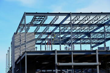 Wall Mural - Two story steel frame commercial building under construction in urban area.