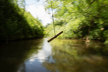 Rope Swing Swinging Above Green River