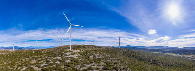 wind turbines, renewable energy on a green hill. wind farm