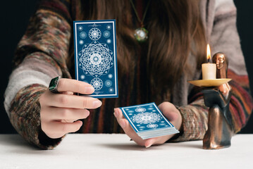 Canvas Print - Fortune teller is reading the future with tarot cards close up.