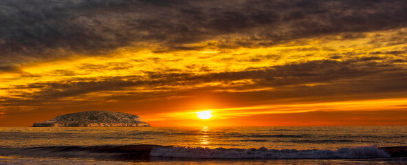 Wall Mural - A beautiful and spectacular sunset by the sea