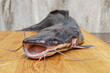 Raw catfish on a cutting board, cooking fish
