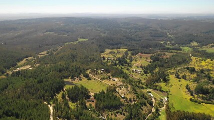 Wall Mural - amazing aerial view of the chilean countryside with the trees in the forest and agricultural fields 