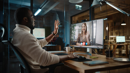 Aufkleber - Handsome Black African American Project Manager is Making a Video Call on Desktop Computer in a Creative Office Environment. Male Specialist Talking to a Caucasian Female Colleague Over a Live Camera.