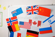 Board with different flags of countries and inscription Intercultural awareness in the middle. Concept of diversity, intercultural, globalisation