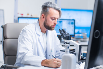 Wall Mural - professional scientist is working on a vaccine in a modern scientific research laboratory. genetic e
