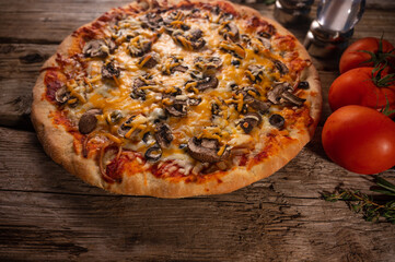 Wall Mural - Italian pizza, ingredients, mushrooms tomatoes on wood background.