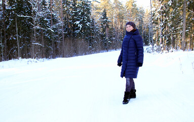 portrait of a woman in the winter forest 