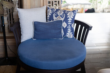 Blue vintage style armchair in reception with pillows