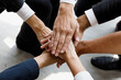 © Bangkok Click Studio - Group of multi colors hands stack together and smiling in the symbol of unity and strong teamwork.