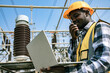 © krumanop - Handsome engineering man holding paper projects plan and using walkie talkie in front of High power power plant. Back view of contractor on background of power plant buildings.