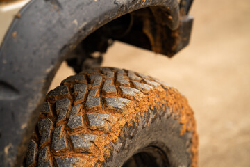 Wall Mural - Muddy off-road opto-cars Mud tires. Close-up.