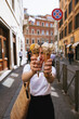 young woman holding ice cream in a waffle cone