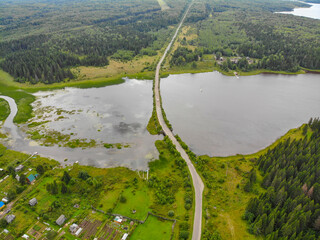 Aerial view of a small bridge over the river in Omutninsk (Kirov region, Russia)