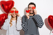 Leinwandbild Motiv Happy attractive young couple celebrating Valentines Day