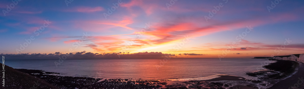 Scenic View Of Sea Against Dramatic Sky During Sunset - obrazy, fototapety, plakaty 