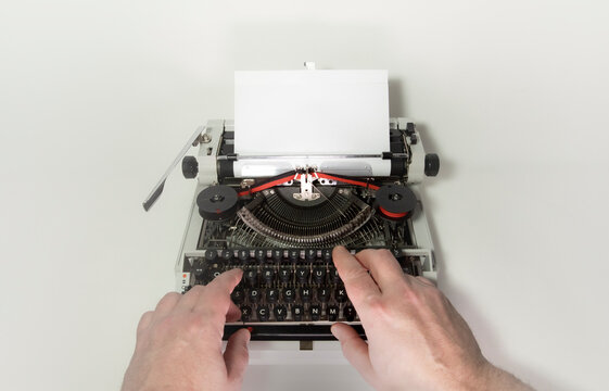 moment of typing on a typewriter close up of an old typewriter