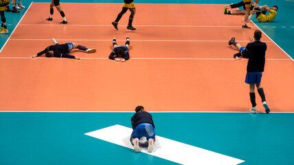 volleyball team before the match. training volleyball players before the match.