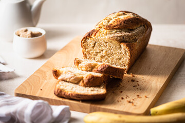 Fresh homemade banana bread on light background.