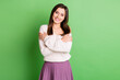 © deagreez - Photo of young happy positive cheerful smiling lovely pretty girl embrace herself isolated on green color background