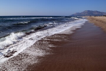 A wave on the shore of a sandy seashore. Patara Beach