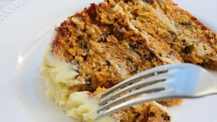 Wall Mural - Piece of homemade carrot cake on a white plate. Eating dessert concept. 