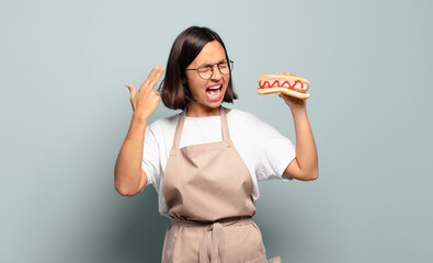 Wall Mural - young pretty chef woman. fast food concept