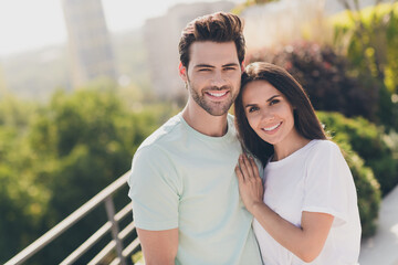 Canvas Print - Photo of cheerful beautiful couple woman guy together hand chest cuddle wear casual clothes street outside