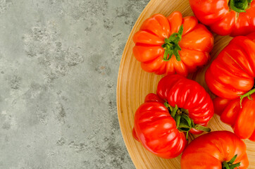 Ripe tasty juicy tomatoes of different shapes. Studio Photo