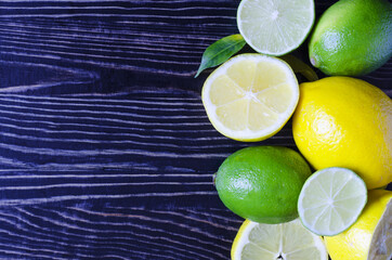 tangerines lemons oranges limes citrus fruits close up on a wooden background kopi space