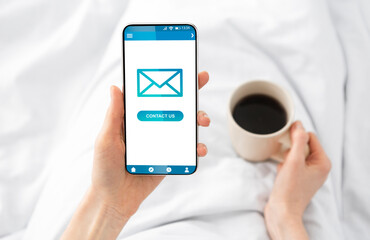 Poster - Lady Sending E-Mail Message On Cellphone Lying In Bed Indoors