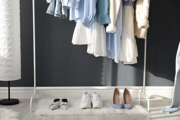 Poster - Rack with stylish women's clothes indoors. Interior design